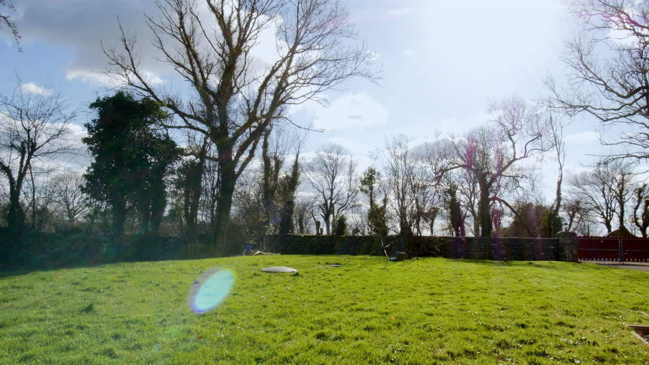 Timelapse of groundskeeper maintaining lawn, capturing steady progress in sunlight