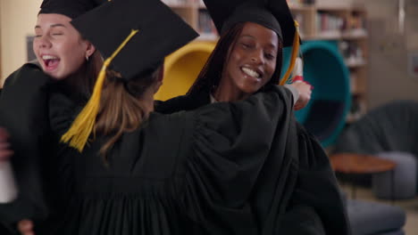two graduating students celebrating their success