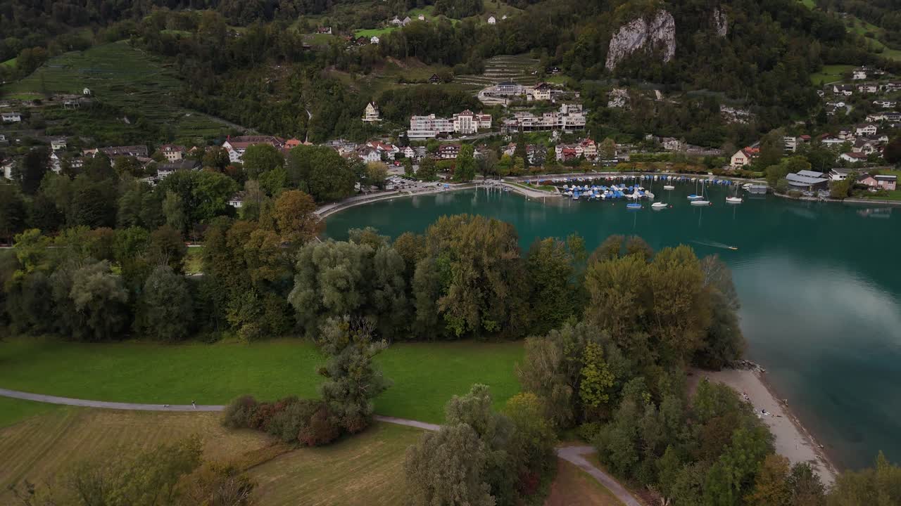 Marina port Lake Walen Switzerland Walensee base of alpine Swiss Alps, aerial