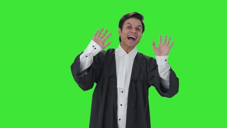 Happy-Indian-lawyer-waving-hello-Green-screen