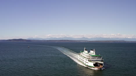 aerial flyover of the seattle car ferry with bainbridge island in the background