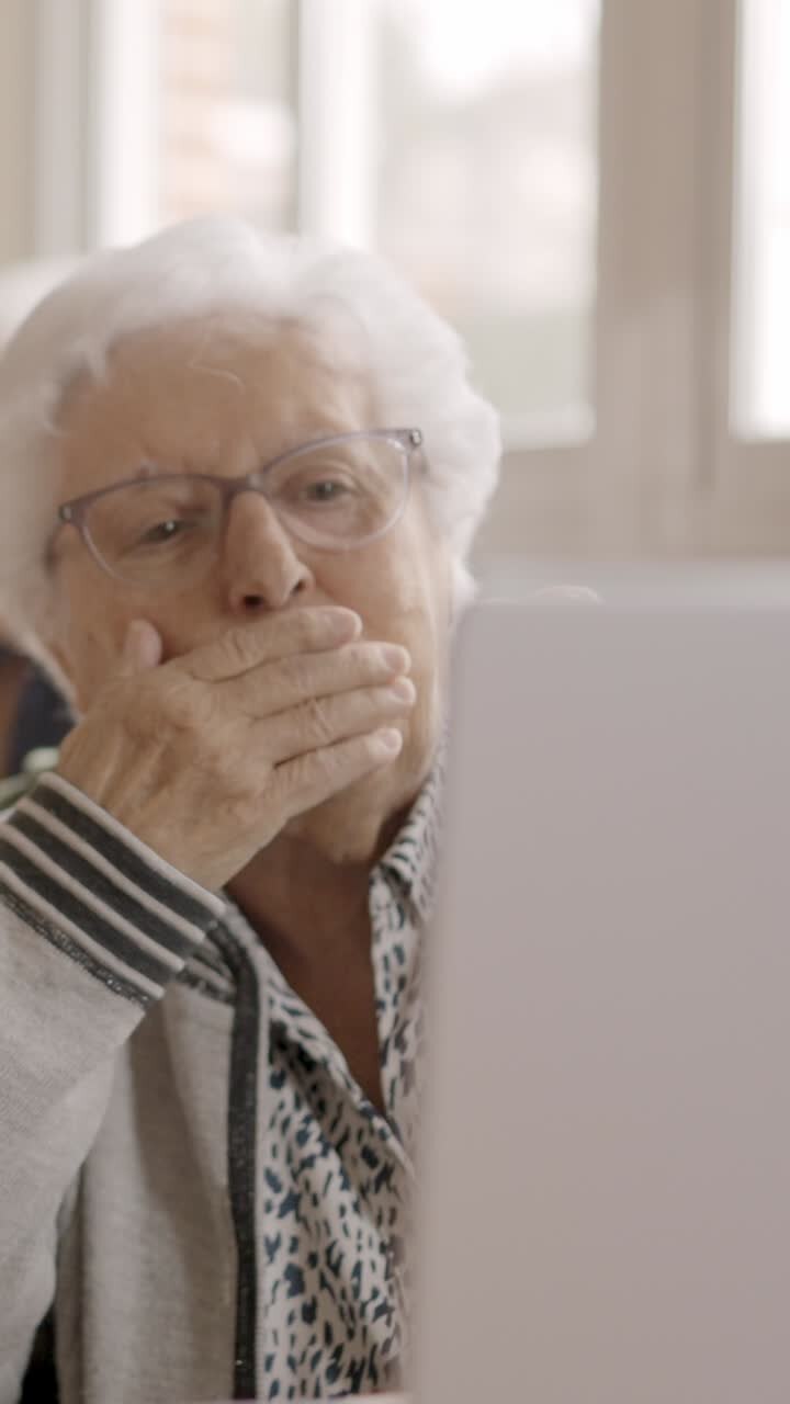 Senior people blowing a kiss during a video call