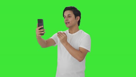 Indian-man-talking-on-video-call-Green-screen