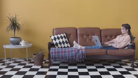 woman working from home on a couch