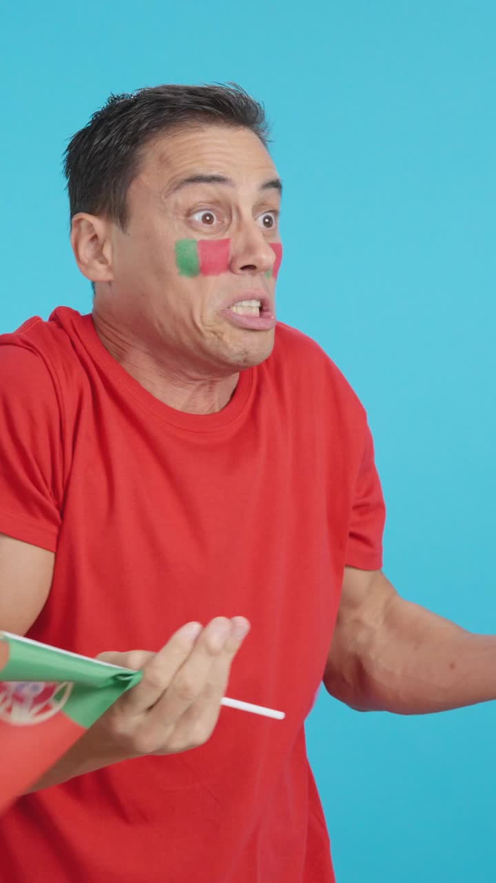 Man cheering for Portugal, angry with the decision of referee