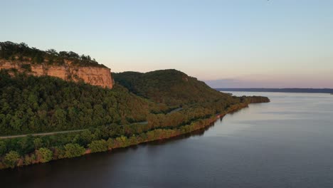 river valley landscape with cliff and road