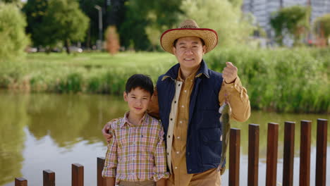 father and son fishing in park