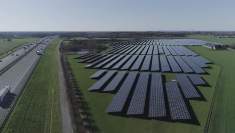 drone shot of solar panels in a big field