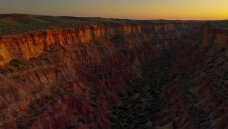 dramatic red rock canyon landscape at sunset