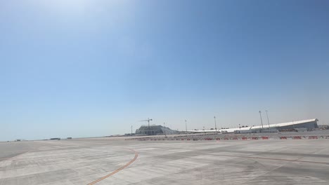 taking off from doha, qatar - hyper lapse of the airport, runway, and shoreline, and ocean