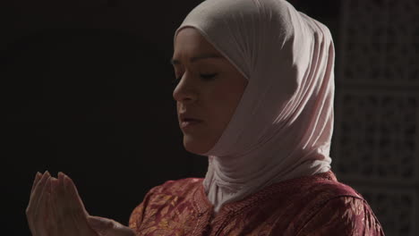 Studio-Head-And-Shoulders-Portrait-Of-Muslim-Woman-Wearing-Hijab-Praying-6