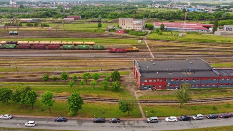 Industrial-logistic-train-station-with-wagons,-aerial-drone-view