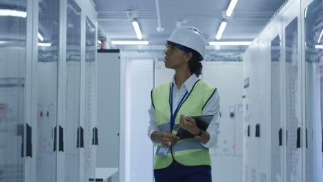 technician inspecting server room equipment