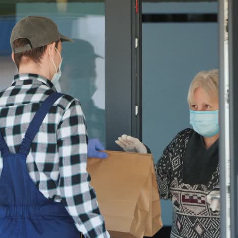 courier brings food bags to elderly woman's home 3