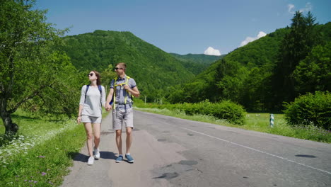 young couple hitchhiking 4k video