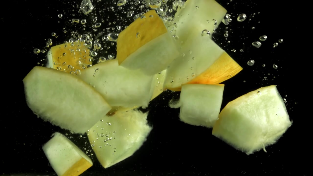 Slow Motion of Melon Chunks Dropping into Water