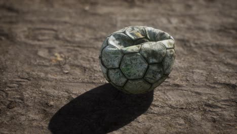 Old-soccer-ball-the-cement-floor