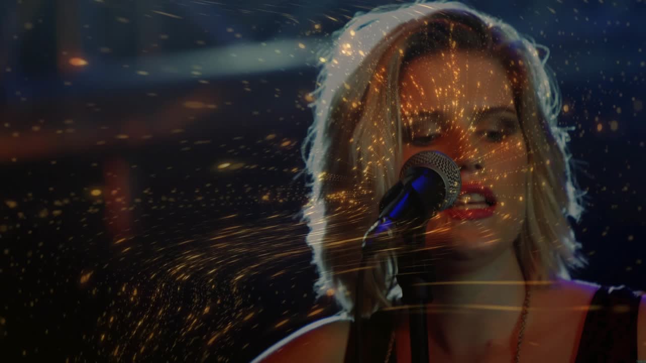 Female music artist strumming guitar, emitting golden particles swirling singing into microphone