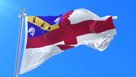 flag of herm waving at wind in slow in blue sky, loop