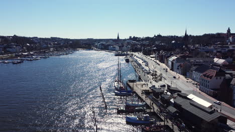 aerial view of a european city harbor with boats and buildings