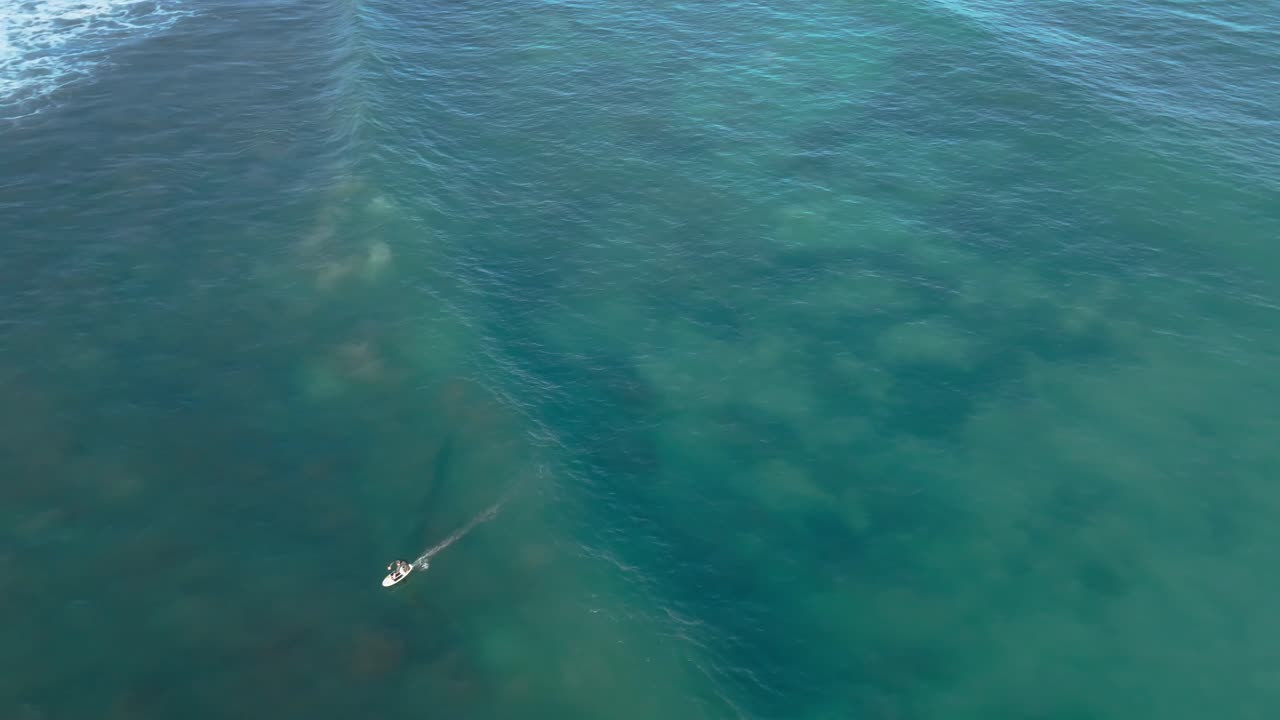 Surfing water sport Mediterranean Sea Spain shallow water wave riding, aerial