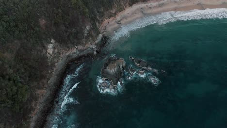 aerial bird's eye view of the scenic mazunte beach in the oaxacan coast