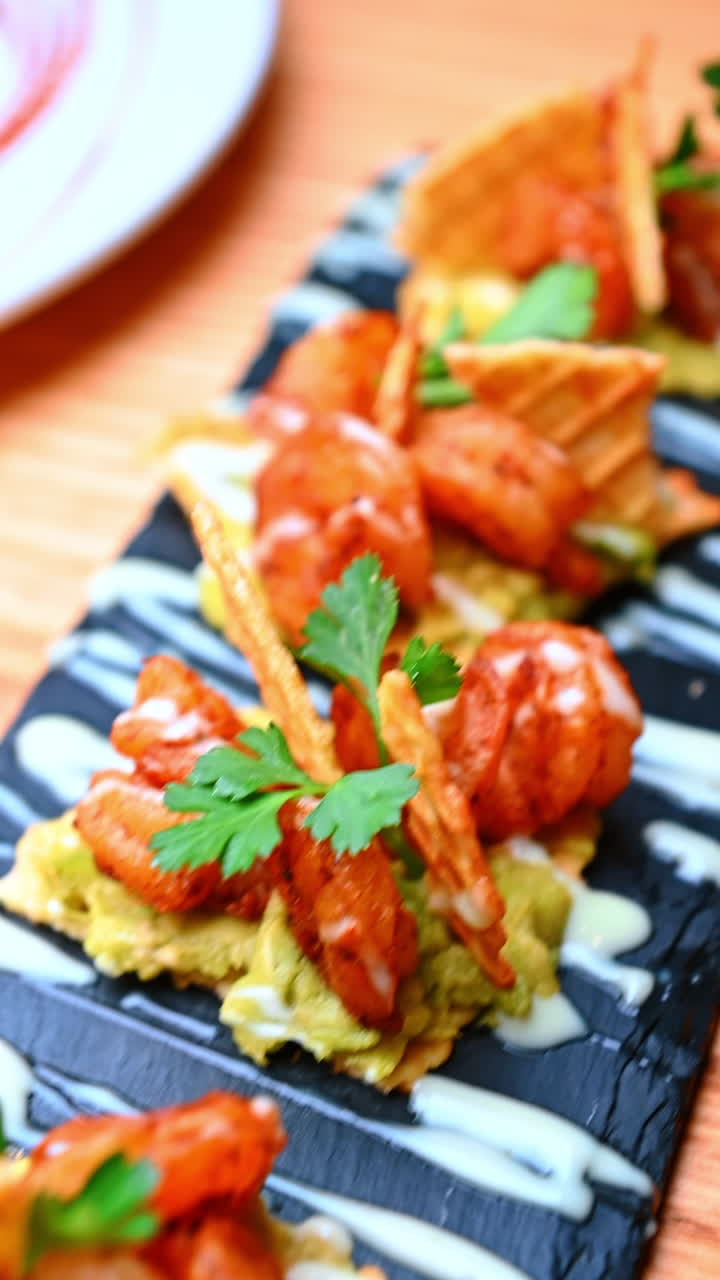 Breakfast plate with toast and garnish. Toast, eggs and fresh vegetables are framed with other cafe dishes in the background