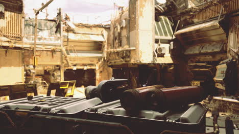 deserted industrial site with scattered equipment and damaged structures