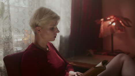 woman reading in a cozy room