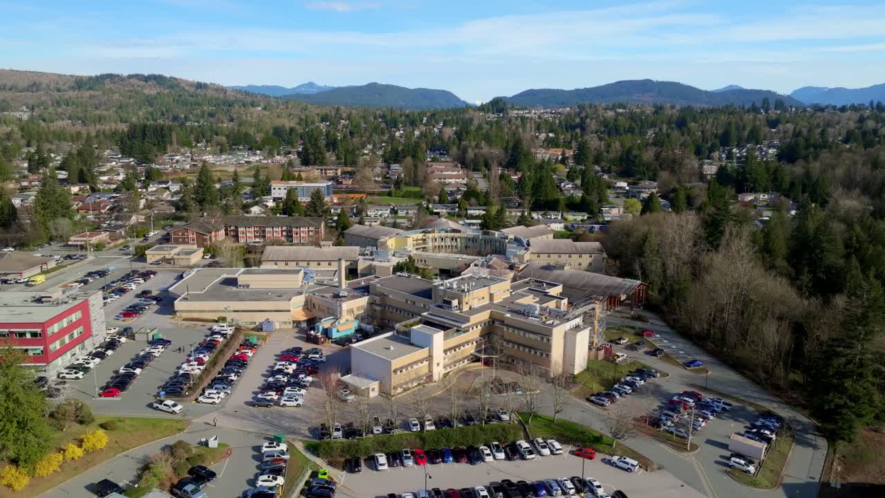 Cars Parked In Front Of The Mission Memorial Hospital In Hurd Street, Mission, BC, Canada. Aerial Drone Shot