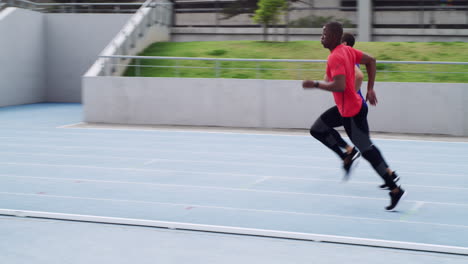 two men running on a track