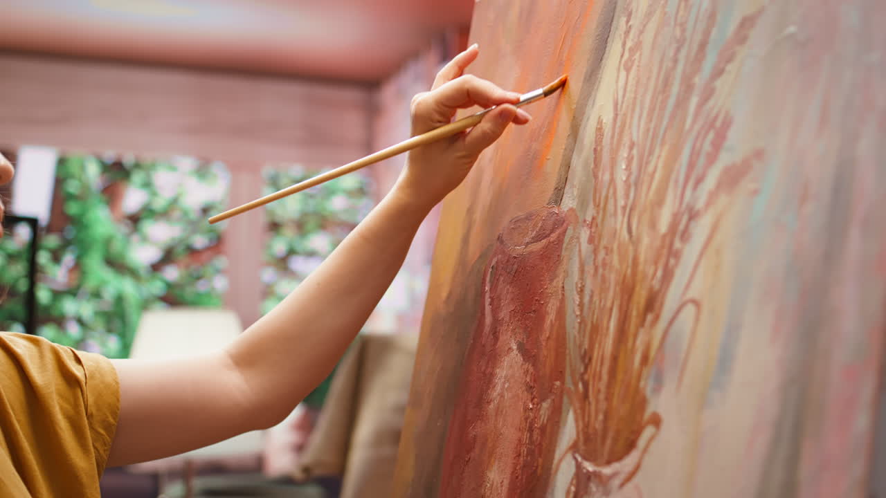 Woman painting a still life