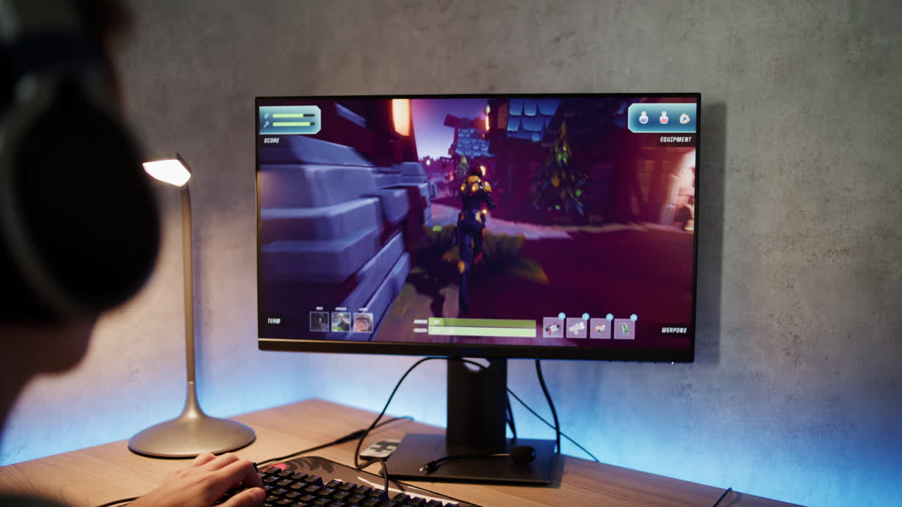 Gamer playing an action video game on a computer