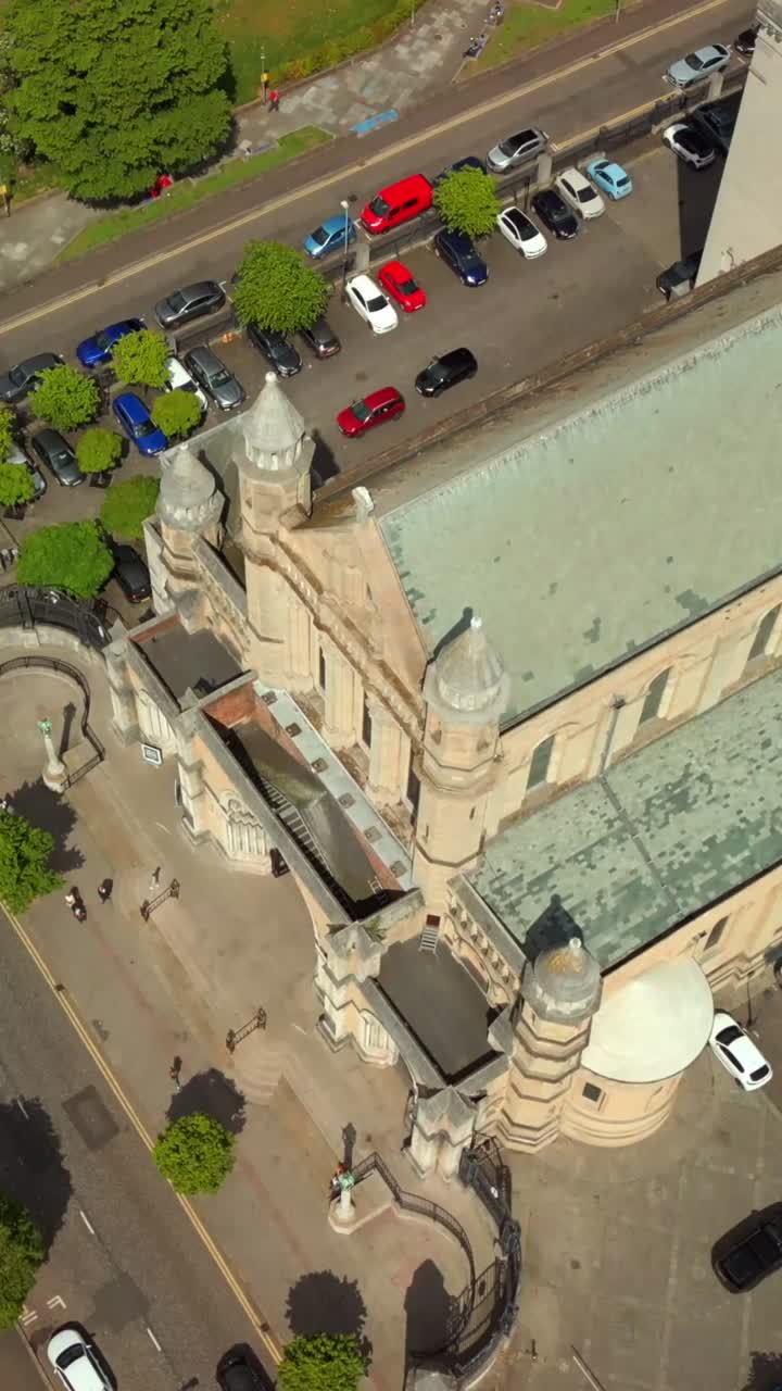 Reversing social ratio aerial of St Anne's Cathedral in Belfast City Centre, Northern Ireland. Filmed in 1080x1920 social ratio with Rec709 color