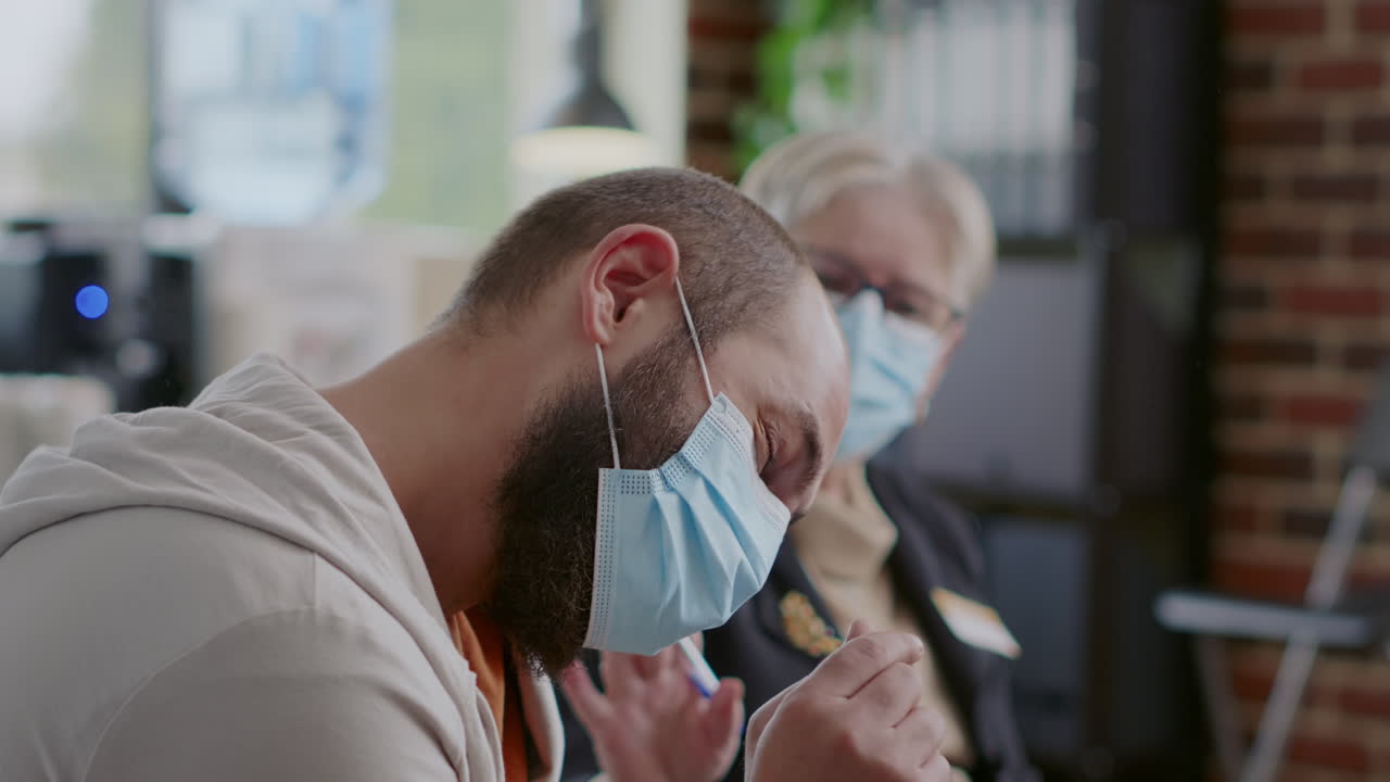 Close up of man crying because of mental health issues at aa therapy meeting