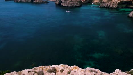 flying over the edge of the coast and above the sea