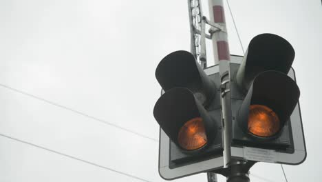 traffic light changing from red to green on a cloudy day