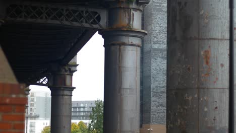Panning-shot-looking-under-steel-transport-bridge