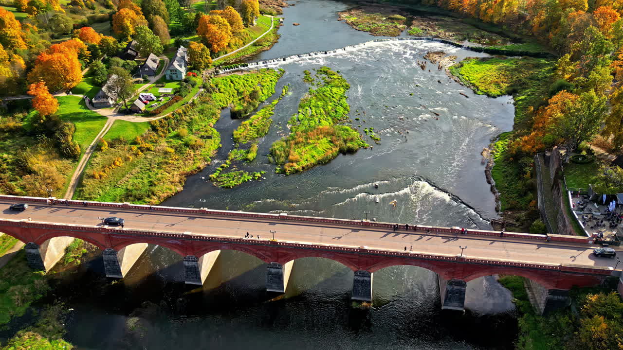 Aerial view of Kuldiga's red brick bridge in autumn, Latvia