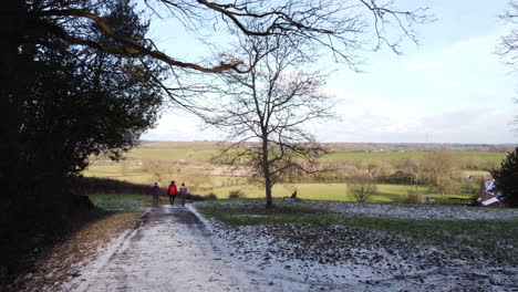 A-farm-track-leading-through-a-farm-gate-opens-up-to-spectacular-views-of-the-Worcestershire-Countryside,-England,-UK-on-a-cold-winters-day