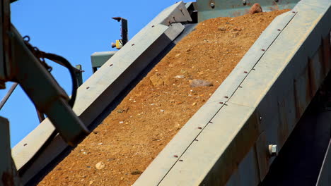 industrial conveyor belt with stones extracted from mine