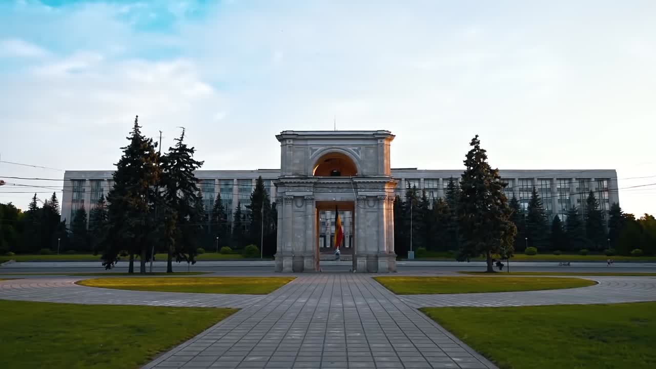 Triumphal Arch with driving cars in center of the city at sunset. Slow motion