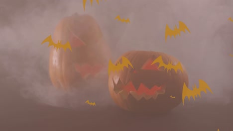 Animation-of-bats-icons-over-halloween-pumpkins