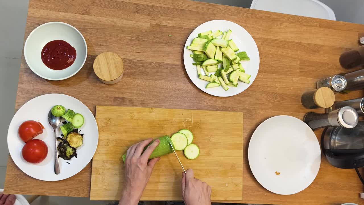 Slicing Zucchini on a Wooden Board
