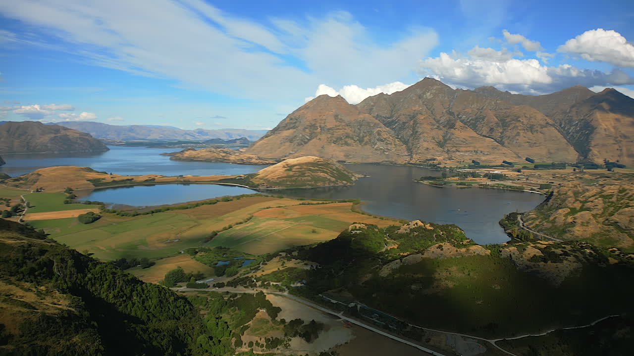 Lake Wanaka in the Remarkables Mountain Range from the Lake Wanaka Track lookout hiking area - aerial parallax