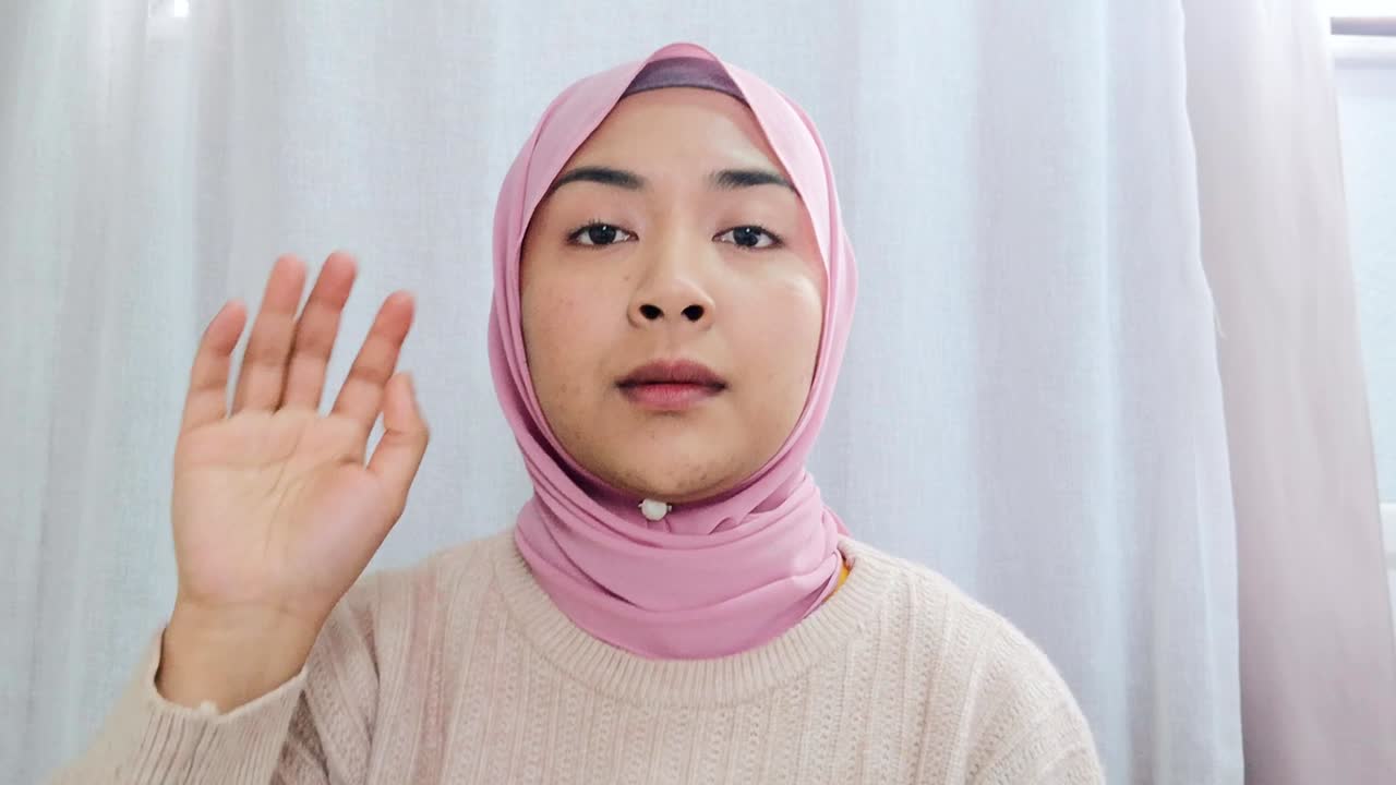 Female Student Asking Question During Video Lecture