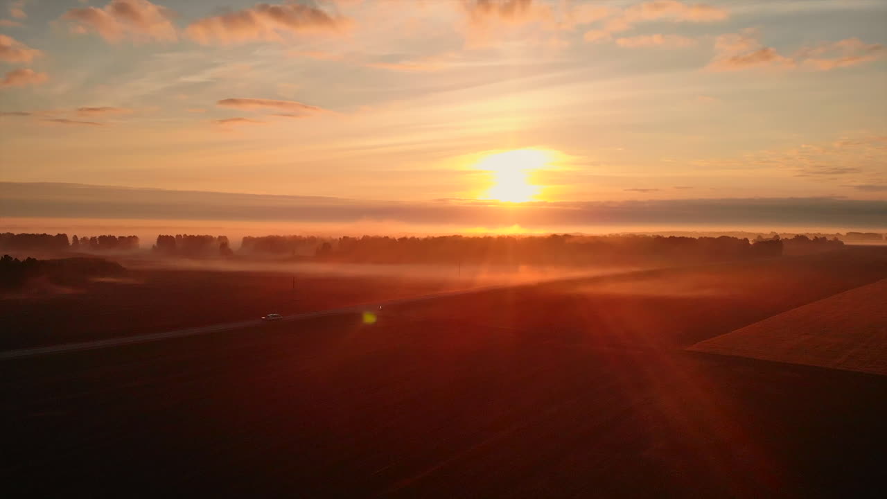 Foggy Sunrise Over a Rural Landscape