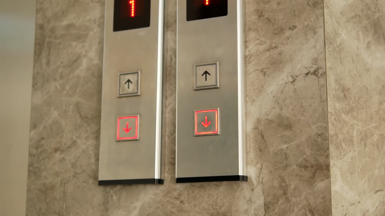 Woman's Hand Pressing Elevator Button By Using Key During Covid-19 Time