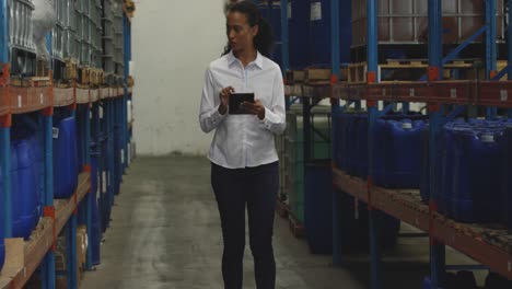 Young-female-manager-worker-in-a-warehouse