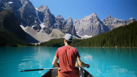 man sitting on a boat in river at countryside 4k